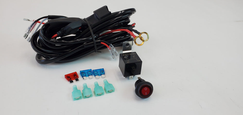 Coiled light harness with relay, switch, fuses, and connectors for Toyota Lexus vehicle installation.