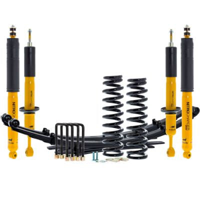Old Man Emu 2005 Tacoma 3-inch lift kit with yellow shocks, coil springs, leaf springs, and hardware on white background.