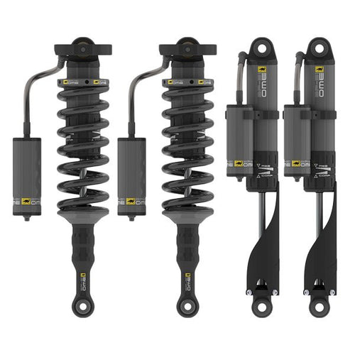 Set of four black OME GX470 GX460 BP 51 3 Heavy Kit shocks with remote reservoirs, front coilovers and rear shocks shown side by side.