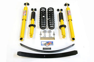Complete heavy load suspension kit for 1998-2004 Tacoma, including shocks, springs, leaf springs, and hardware.