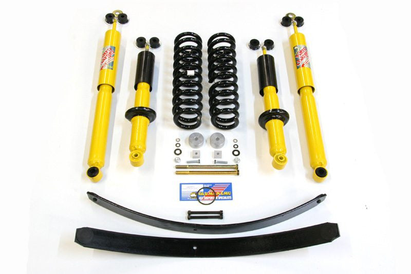 Complete heavy load suspension kit for 1998-2004 Tacoma with yellow shocks, coil springs, leaf springs, and mounting hardware.