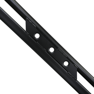 Close-up of black powder-coated steel rock slider with welded mounting bracket and bolt holes.