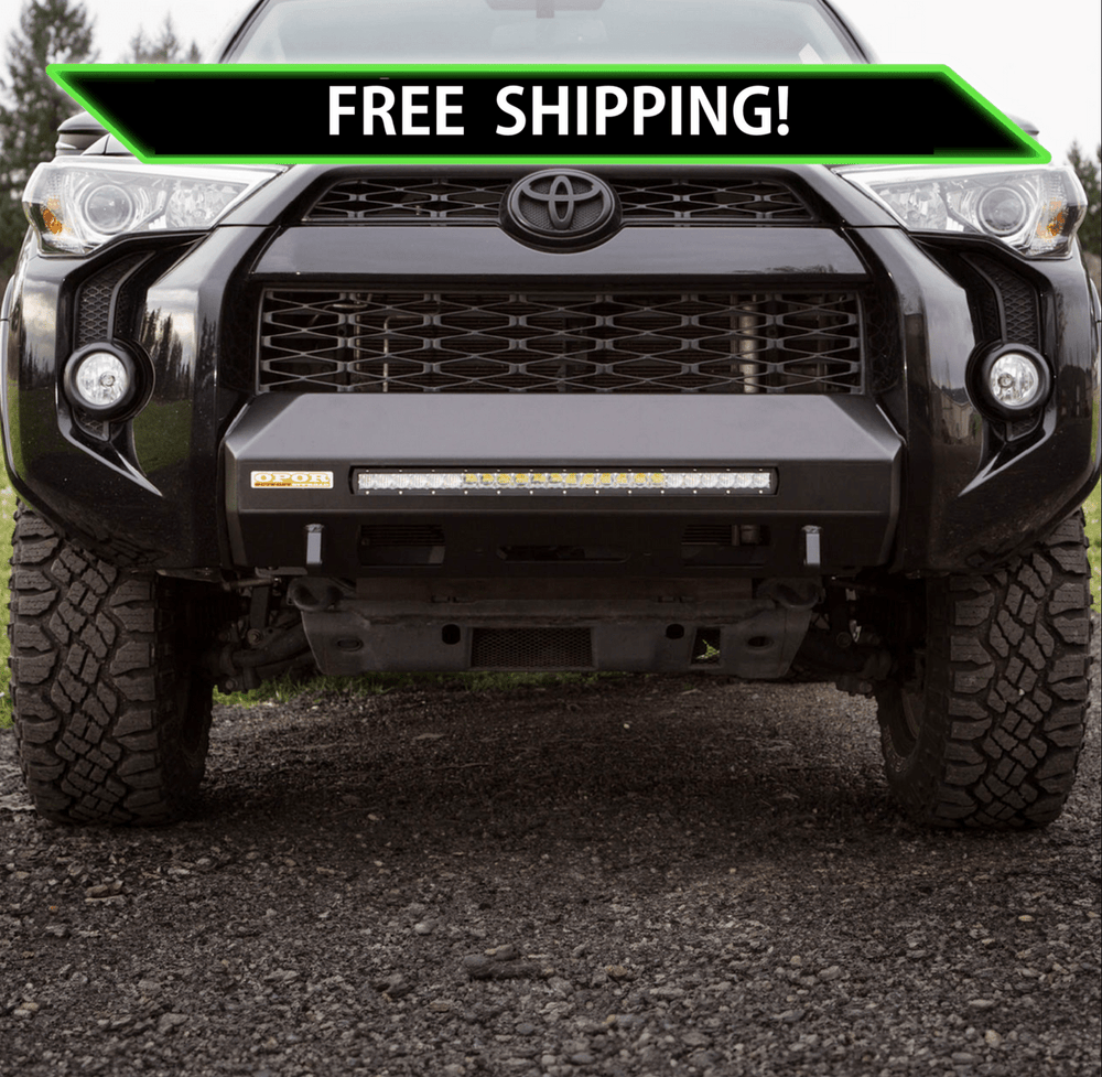 Front view of black 2014 Toyota 4Runner with MetalTech 4x4 Stronghold winch bumper installed on gravel.