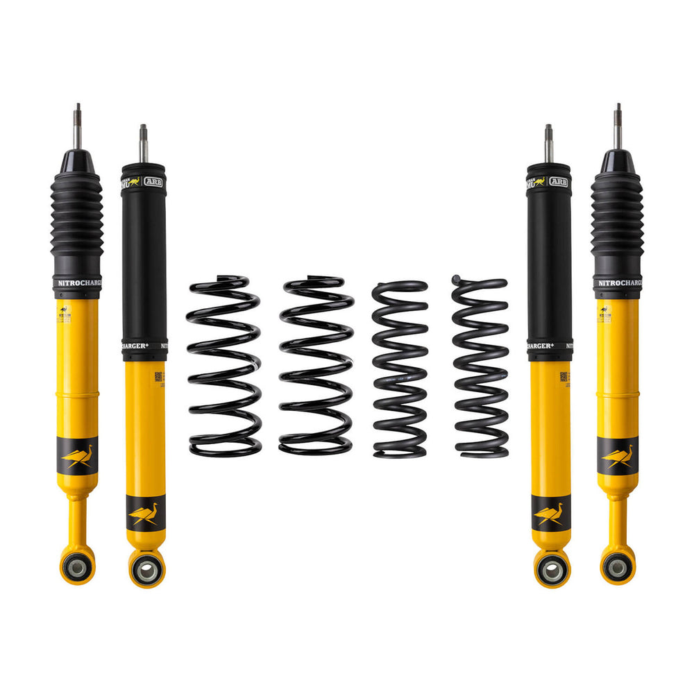Four yellow Nitrocharger shock absorbers and four black coil springs for 4Runner GX470 suspension lift kit.
