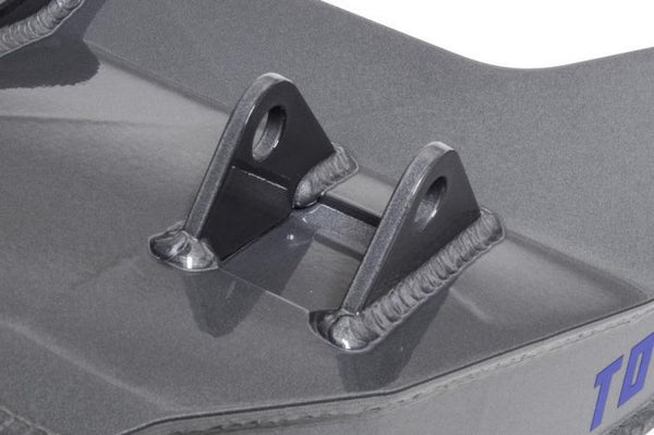Close-up of welded mounting bracket on gray Total Chaos 4130 Expedition lower control arm for 05-15 Tacoma.