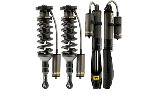 Four black and gray off-road coilover shocks with external reservoirs for 2010 4Runner suspension upgrade.
