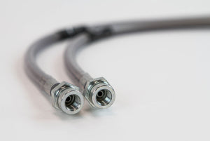 Close-up of two metal extended rear brake lines with threaded fittings for Lexus GX470 and GX460 on white background.