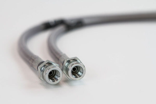 Close-up of two metal extended rear brake lines with threaded fittings for Lexus GX470 and GX460 on white background.