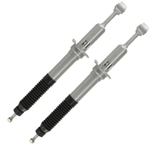 Pair of silver replacement front struts with black protective boots for GX470, designed for comfort ride plus suspension.