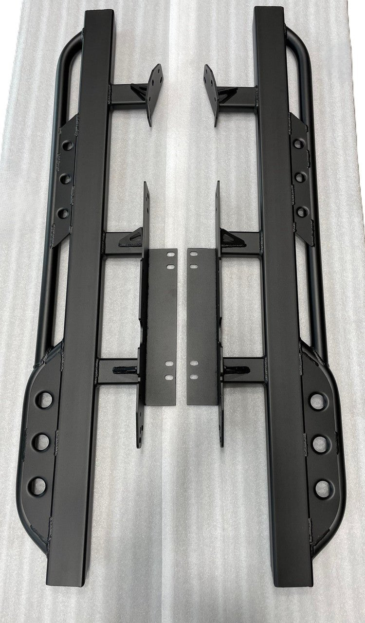 Pair of black metal rock sliders with mounting brackets for 2008-2021 Toyota Land Cruiser, laid flat on white surface.