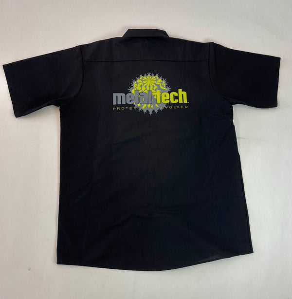 Black short-sleeve men's work shirt with Metal Tech logo and graphic on the back.