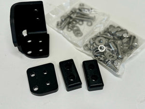Black left side latch components and hardware for landing pad system on white surface.