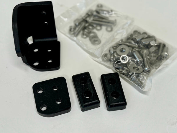 Black left side latch components and hardware for landing pad system on white surface.
