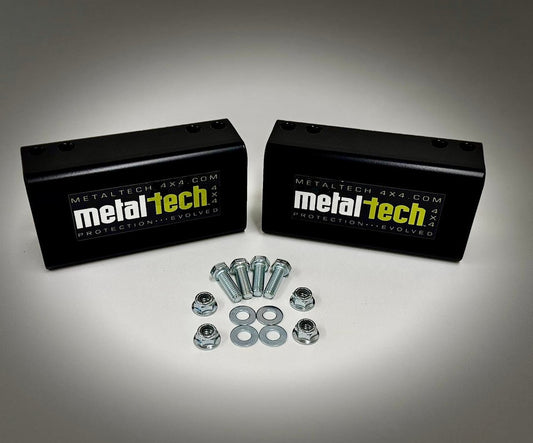 Two black Metal Tech rear bump stop drop blocks with bolts, nuts, and washers for Lexus GX470/GX460 long travel suspension.