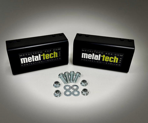 Two black Metal Tech rear bump stop drop blocks with bolts, nuts, and washers for Lexus GX470/GX460 long travel suspension.