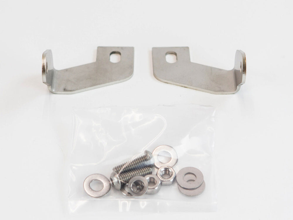 Two metal LED light bar brackets with mounting screws, nuts, and washers in a clear plastic bag on a white background.