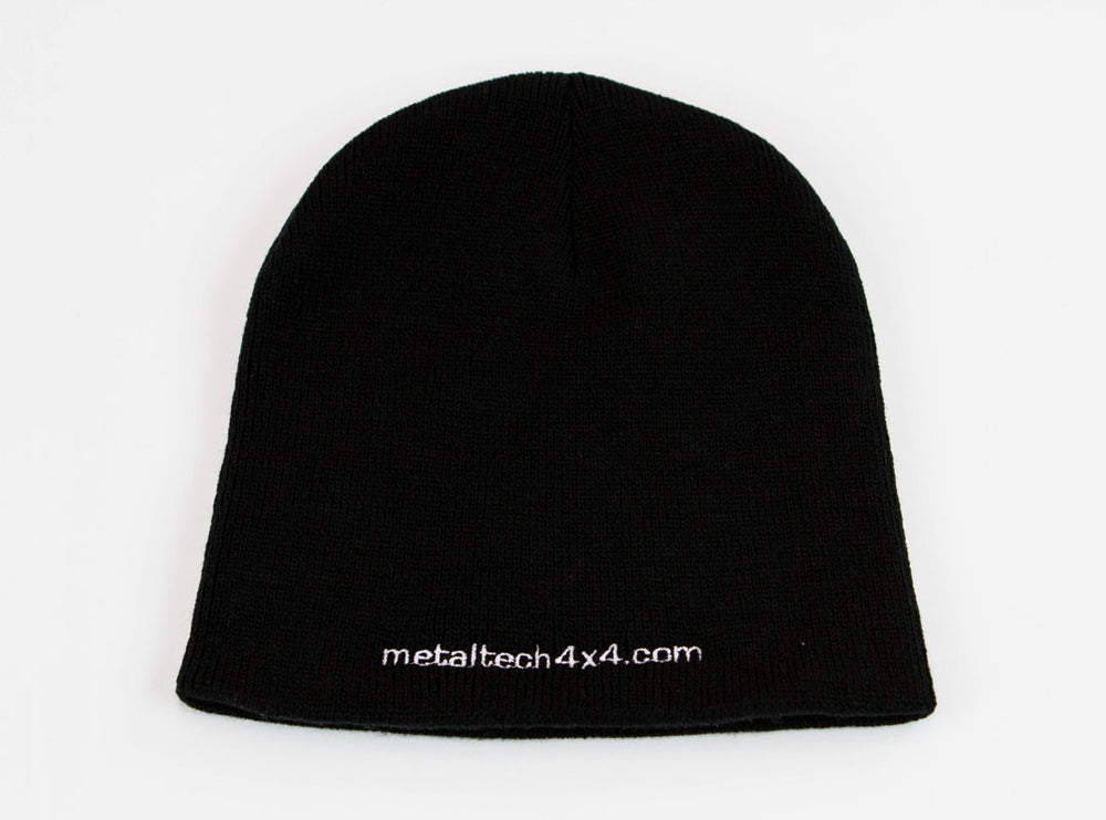 Black knit beanie with white embroidered "metaltech4x4.com" logo on front edge.