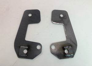 Pair of raw steel caster correction plates for FJ80 Land Cruiser, showing front and back with weld details.