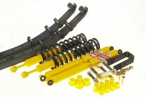 Yellow shock absorbers, black coil springs, leaf springs, and hardware for 2005-15 Tacoma light load suspension kit.
