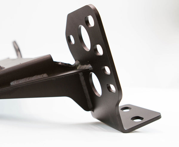 Close-up of black metal bracket with multiple mounting holes for 2014 4Runner Stronghold winch bumper installation.