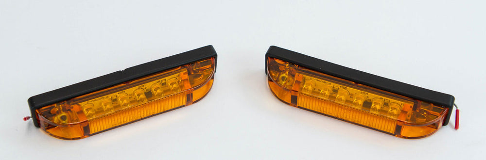 Pair of amber LED step lights with black trim for GX470 and GX460 rear bumpers, shown side by side on white background.
