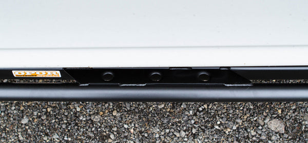 Close-up of black metal rock slider mounted on 2010 4Runner with Opor Offroad logo visible.