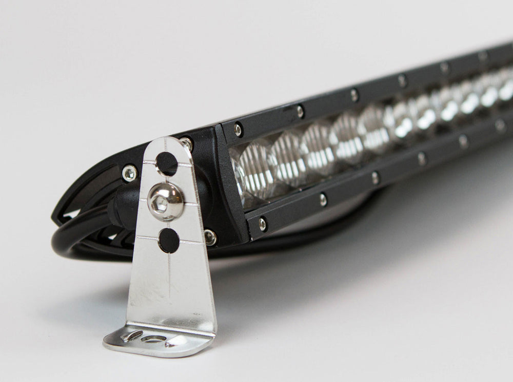 Close-up of a black 150W single-row LED light bar with 30 lenses and attached wiring harness.