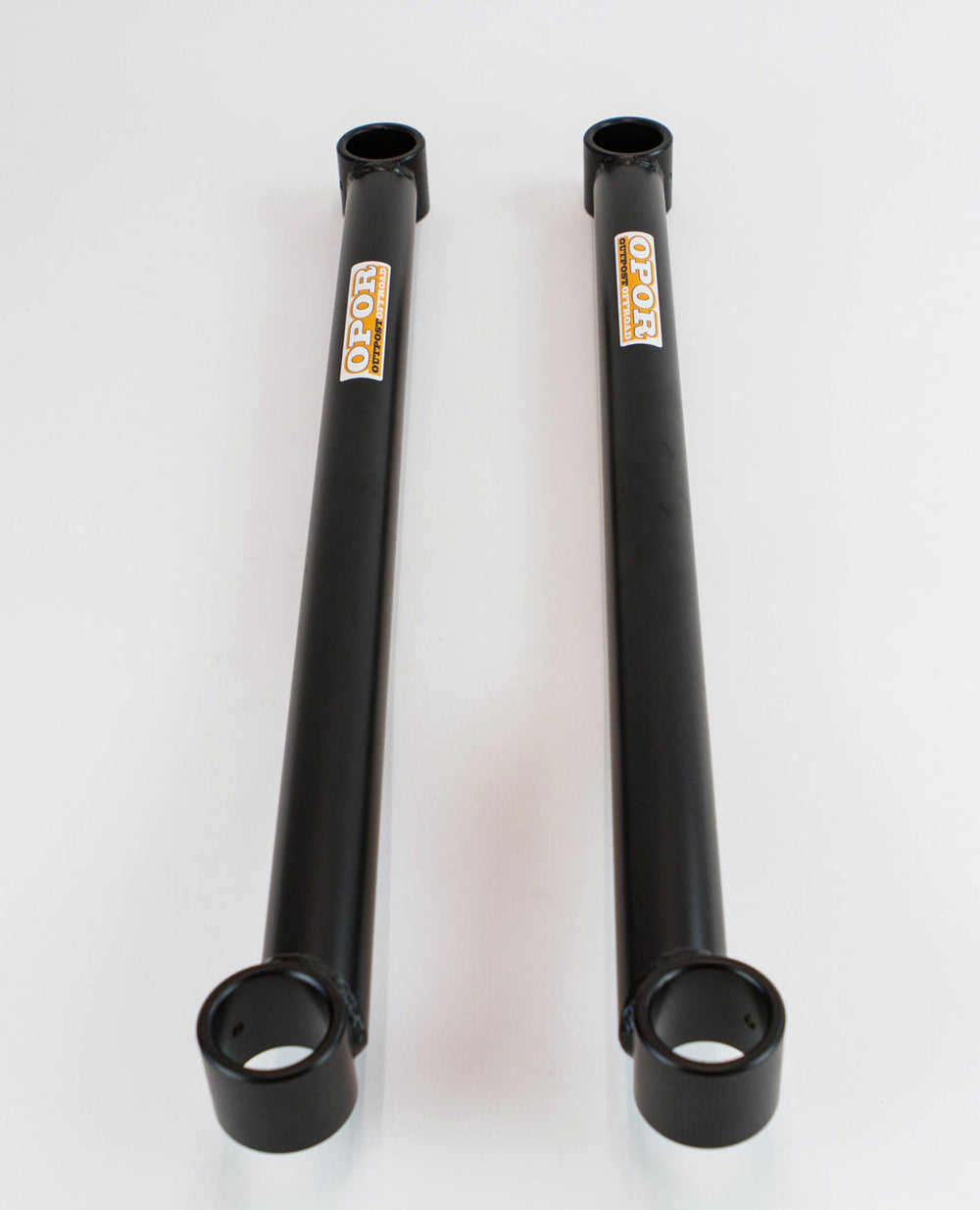 Pair of black offset lower control arms with Opor logo, designed for 100 Series Land Cruiser and LX470 suspension upgrades.