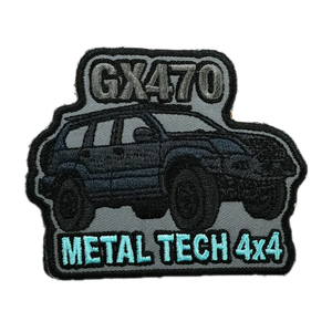Embroidered patch showing a GX470 SUV with "METAL TECH 4x4" text on gray and black background.