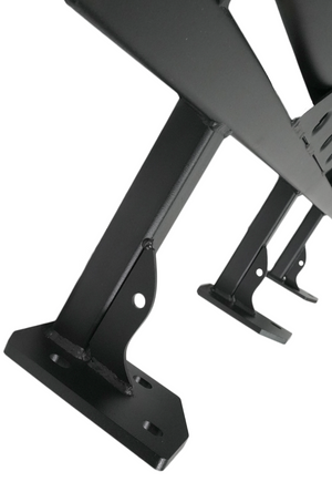 Close-up of black metal mounting brackets and welds on a 2010 4Runner trail rock slider for off-road protection.