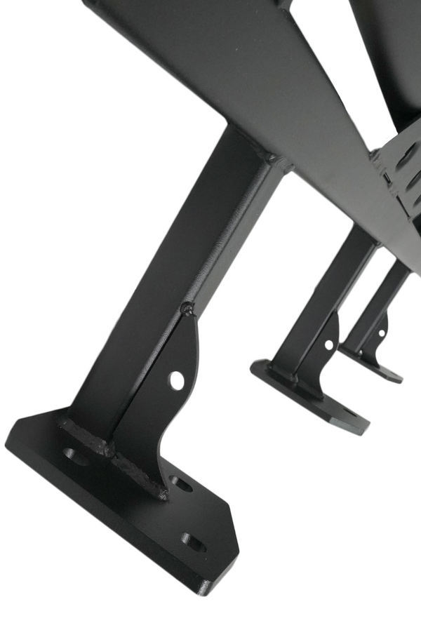 Close-up of black metal mounting brackets and welds on a 2010 4Runner trail rock slider for off-road protection.