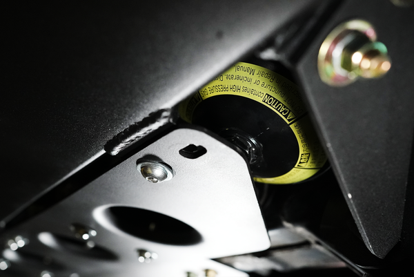 Close-up of metal bracket and bolt detail on Metal Tech 4x4 Lexus LX570 rock sliders installation.