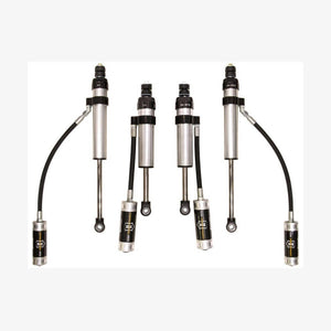 Set of four silver and black performance shock absorbers with remote reservoirs for Toyota Land Cruiser 100 Series and Lexus LX470.