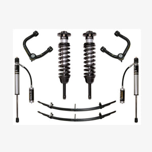 Complete Stage 3 suspension system with tubular upper control arms, coilover shocks, leaf springs, and remote reservoirs for 2005-2015 Toyota Tacoma.