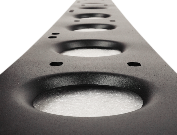 Close-up of black powder-coated metal rock slider with circular cutouts for Lexus LX570 4x4 protection.
