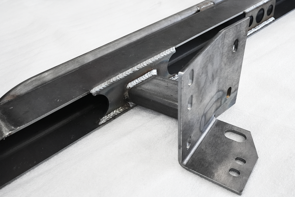 Close-up of welded steel bracket and mounting points on Metal Tech 200 Series Toyota Land Cruiser rock slider.