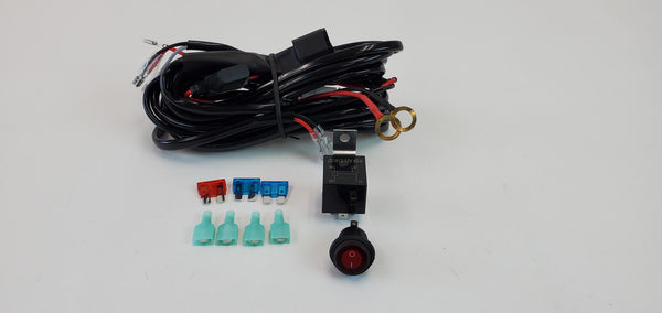 Coiled light harness with relay, switch, fuses, and connectors for Toyota Lexus vehicle installation.