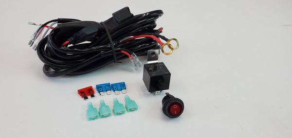 Coiled light harness kit with relay, switch, fuses, and connectors for Toyota and Lexus vehicles.