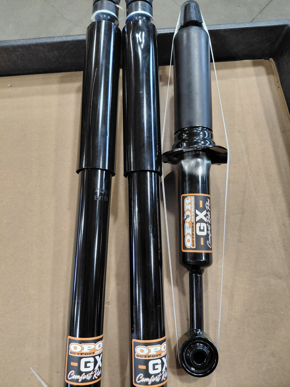 Four silver replacement struts and rear shocks with mounting hardware for Lexus GX 470/460 suspension kit on white background.
