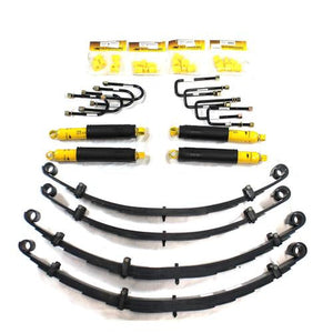 Heavy-duty suspension kit with yellow shocks, leaf springs, U-bolts, and bushings for 2-inch lift on FJ60-FJ62 trucks.