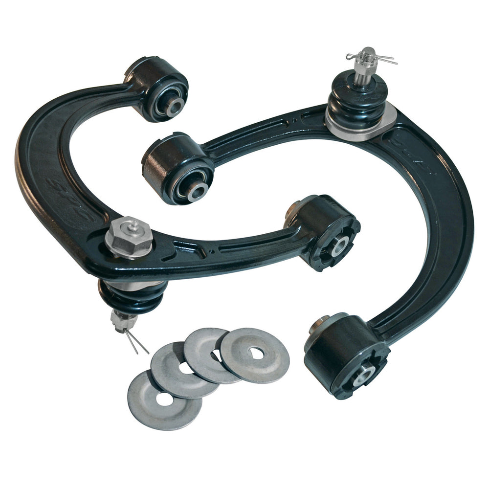 Pair of black SPC upper control arms for 2005 Tacoma with ball joints and included metal washers, isolated on white background.