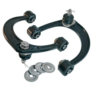 Pair of black SPC upper control arms for 2005 Tacoma with ball joints and included metal washers, isolated on white background.