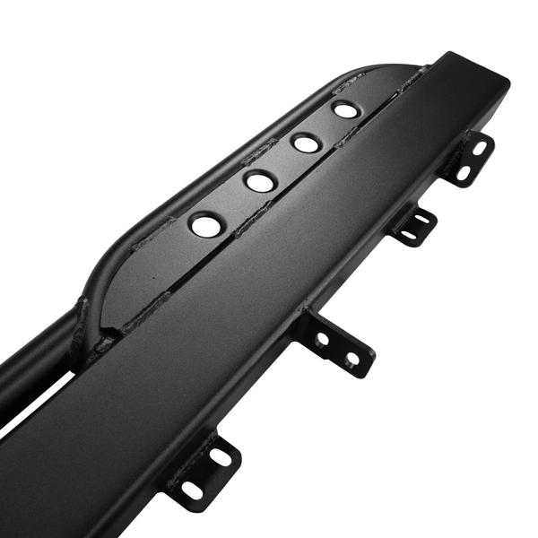 Close-up of black steel rock slider with mounting brackets and circular cutouts for Lexus LX570 off-road protection.