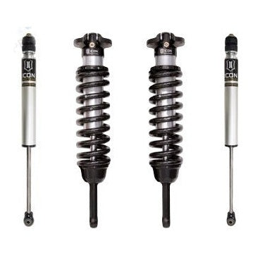 Front and rear coilover shocks for 2016-up Toyota Tacoma suspension system stage 1, silver and black finish.