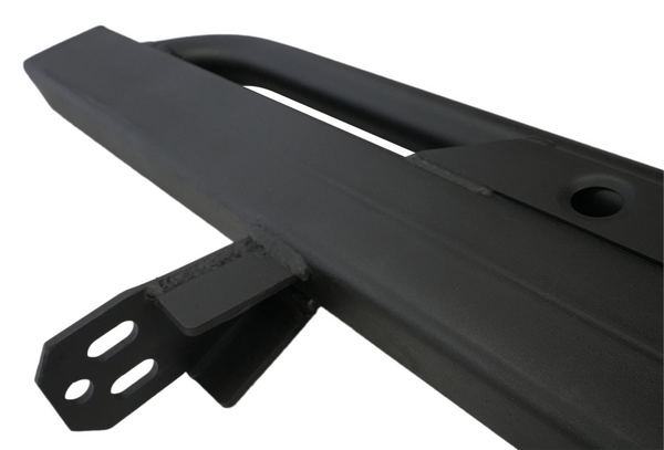 Close-up of black metal rock slider with mounting bracket for 2021 Ford Bronco 4-door, scratch and dent condition.