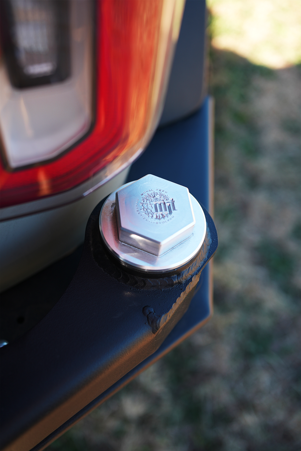 Close-up of Metal Tech 4x4 hex bolt on black Bronco 6G rear ACES high bumper near tail light.