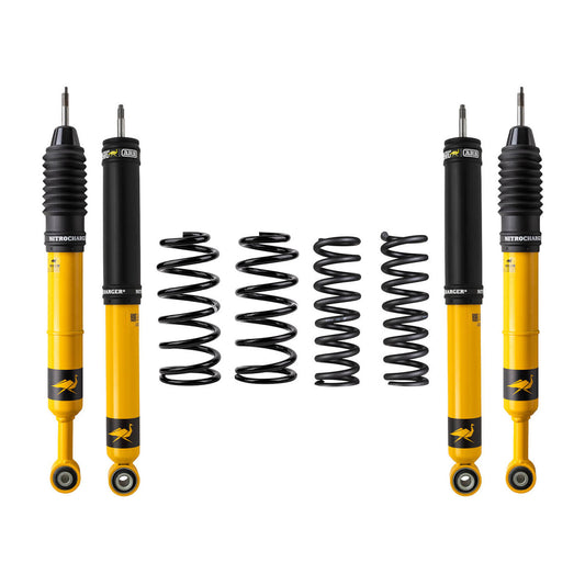 Yellow and black Nitrocharger shock absorbers with four black coil springs for Lexus GX470 suspension lift kit.