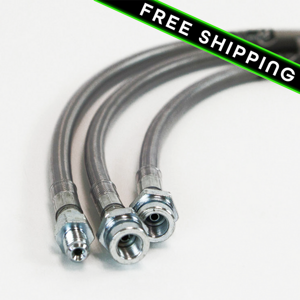 Close-up of three stainless steel extended brake lines with fittings for 80 Series Land Cruiser lifts 3 to 6 inches.