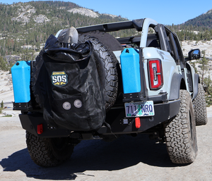 Rear view of white Bronco 6G with Metal Tech 4x4 Aces High rear bumper installed, carrying spare tire and gear.