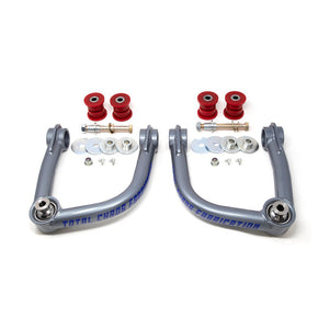 Pair of gray Total Chaos upper control arms with red polyurethane bushings and mounting hardware for 2021 Bronco.